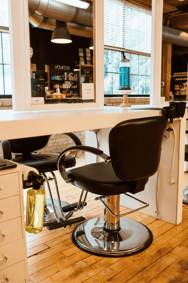 Empty salon chair | QVD Salon in Holland, MI.