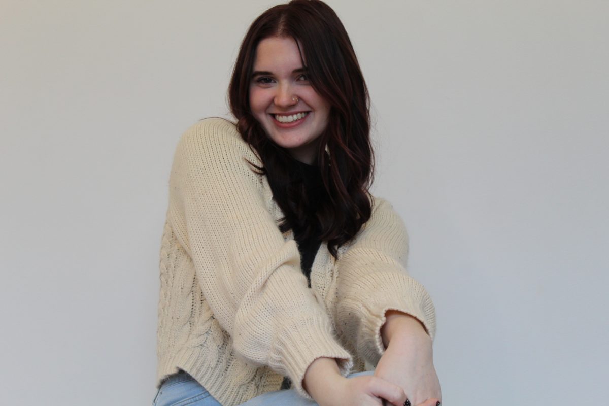 Emma, fantasy and vivid color specialist at Quinn Vise Hair Design in Holland, Michigan.