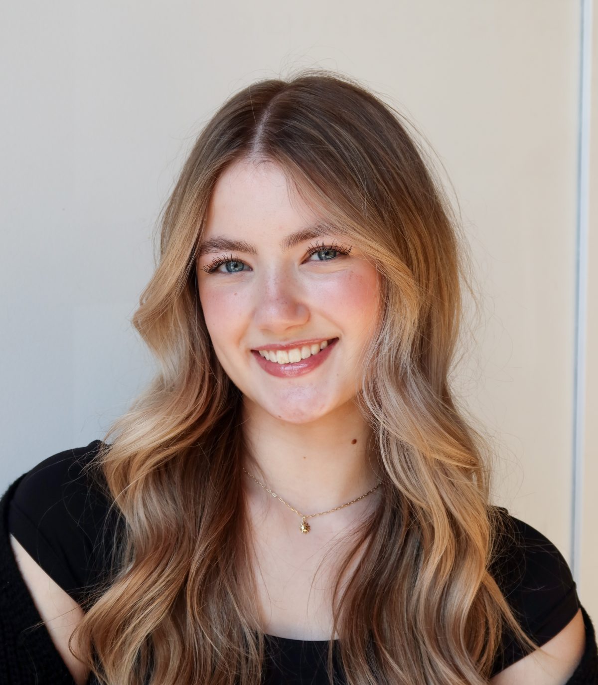 Hannah, hand-tied hair extension specialist at Quinn Vise Hair Design in Holland, Michigan.