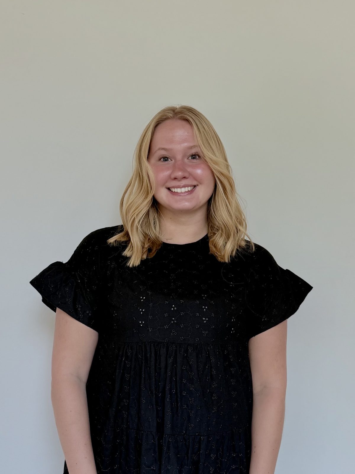 Tristen, hair and makeup artist at Quinn Vise Hair Design in Holland, Michigan.