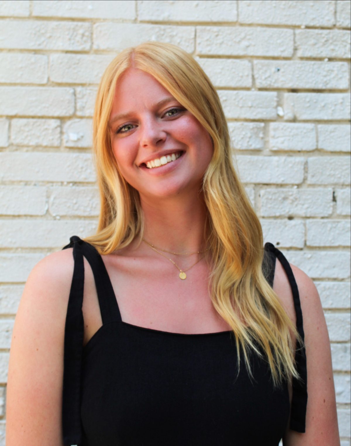 Whitney, blonding colorist at Quinn Vise Hair Design in Holland, Michigan.